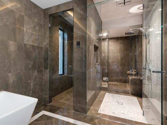 Luxurious bathroom with glass shower enclosure